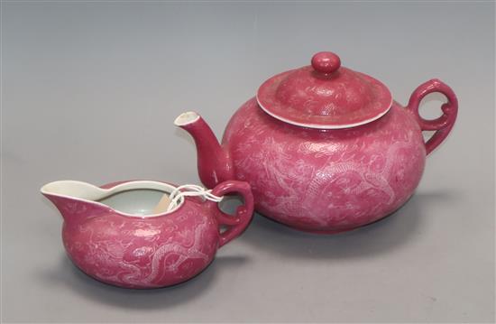 A Chinese ruby ground sgraffito dragon teapot and milk jug , Republic period